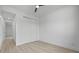 Bright bedroom with closet, neutral colors, and modern ceiling fan at 17156 Eugene Ave, Port Charlotte, FL 33954