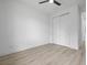 Bedroom with sliding door closet, ceiling fan, and luxury vinyl flooring at 17156 Eugene Ave, Port Charlotte, FL 33954