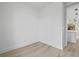 Bright bedroom with light wood-look flooring and doorway leading to other rooms at 17156 Eugene Ave, Port Charlotte, FL 33954