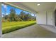 Large covered patio offers a relaxing outdoor space with a view of the lush green backyard at 17156 Eugene Ave, Port Charlotte, FL 33954