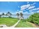 Expansive waterfront views from the lush backyard, complete with a private dock and mature landscaping at 17509 Ohara Dr, Port Charlotte, FL 33948