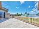 Beautiful tile balcony with stone railings overlooking waterfront view and blue skies at 17509 Ohara Dr, Port Charlotte, FL 33948