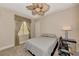 Neutral bedroom with ceiling fan, carpet, one window, and black desk at 17509 Ohara Dr, Port Charlotte, FL 33948