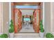 Grand foyer with an open wooden doorway, views of living area, and a dining space at 17509 Ohara Dr, Port Charlotte, FL 33948