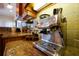 Close up of a stainless steel espresso machine on a granite countertop, showcasing the modern kitchen appliances at 17509 Ohara Dr, Port Charlotte, FL 33948