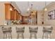 Spacious kitchen with granite counters, modern appliances, and a breakfast bar, perfect for casual dining and entertaining at 17509 Ohara Dr, Port Charlotte, FL 33948
