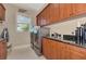 Well-equipped laundry room with modern appliances and ample storage at 17509 Ohara Dr, Port Charlotte, FL 33948