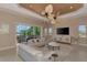 Open living room with ceiling fan, TV, and water views at 17509 Ohara Dr, Port Charlotte, FL 33948