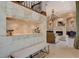 Inviting living room featuring a decorative fireplace, a stylish chandelier, and ample seating for gatherings and relaxation at 17509 Ohara Dr, Port Charlotte, FL 33948