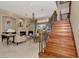 Bright and inviting living room with marble fireplace, elegant chandelier, and staircase at 17509 Ohara Dr, Port Charlotte, FL 33948