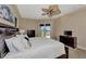 Bright main bedroom with water views from the private balcony and ceiling fan at 17509 Ohara Dr, Port Charlotte, FL 33948
