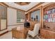 Cozy office space with custom wood built-ins and ample natural light at 17509 Ohara Dr, Port Charlotte, FL 33948