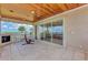 Covered outdoor patio with fireplace, wood ceiling, and beautiful water views at 17509 Ohara Dr, Port Charlotte, FL 33948
