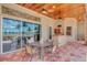Covered patio with outdoor dining area with waterfront views and ceiling fans at 17509 Ohara Dr, Port Charlotte, FL 33948