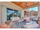 Covered outdoor patio area with living area and waterfront view at 17509 Ohara Dr, Port Charlotte, FL 33948
