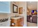 Elegant powder room with granite countertop, custom cabinets, and decorative mirror at 17509 Ohara Dr, Port Charlotte, FL 33948
