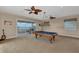 Game room with a pool table and a waterfront balcony overlooking the beautiful views at 17509 Ohara Dr, Port Charlotte, FL 33948