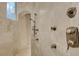 Modern shower with multiple shower heads and custom tile work at 17509 Ohara Dr, Port Charlotte, FL 33948