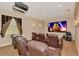 Home theater with plush seating, large screen, and surround sound system at 17509 Ohara Dr, Port Charlotte, FL 33948