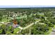 An aerial view of a single-Gathering home featuring a pool and a well-maintained lawn at 1762 Mincey Ter, North Port, FL 34286