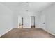 Spacious bedroom with neutral paint, closet, and doorway to the bathroom at 1762 Mincey Ter, North Port, FL 34286