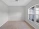 This bedroom is bright and spacious, featuring a large window and tiled floors for easy cleaning at 1762 Mincey Ter, North Port, FL 34286