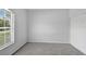 Spacious bedroom with carpet, window and closet at 1762 Mincey Ter, North Port, FL 34286