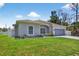 A bright, single-Gathering home with a well-kept lawn and attached two car garage at 1762 Mincey Ter, North Port, FL 34286