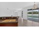 Kitchen area features a breakfast bar overlooking the living room with sliding glass doors out to the pool at 1762 Mincey Ter, North Port, FL 34286