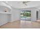 Open living space with a built-in niche and a sliding glass door to the pool at 1762 Mincey Ter, North Port, FL 34286