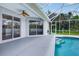 Covered patio leads to screened in pool area at 1762 Mincey Ter, North Port, FL 34286