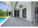 This is an inviting outdoor pool and patio space with a ceiling fan and screened-in enclosure for relaxation and enjoyment at 1762 Mincey Ter, North Port, FL 34286