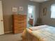 Bedroom featuring neutral walls, carpeted floors and a view into the bathroom at 18094 Ackerman Ave, Port Charlotte, FL 33948
