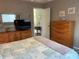 Bedroom featuring neutral walls, carpeted floors and a view into the bathroom at 18094 Ackerman Ave, Port Charlotte, FL 33948
