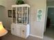 Living room features a decorative display cabinet with glass shelves and coastal decor at 18094 Ackerman Ave, Port Charlotte, FL 33948