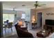 Open-concept living room offering a view into the adjacent dining and kitchen areas at 18094 Ackerman Ave, Port Charlotte, FL 33948