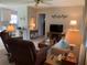 Cozy living room featuring comfortable seating and an open layout with views to the kitchen at 18094 Ackerman Ave, Port Charlotte, FL 33948