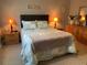 Relaxing bedroom with comfortable bedding and warm lighting at 18094 Ackerman Ave, Port Charlotte, FL 33948