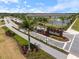 Aerial shot of the West Port community entrance with beautiful landscaping at 1992 Sunset Preserve Way, Port Charlotte, FL 33953