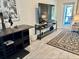 Well-decorated living room featuring modern furniture, a large television, and neutral-toned decor at 1992 Sunset Preserve Way, Port Charlotte, FL 33953