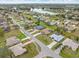 Aerial shot of homes in the neighborhood, showing the surrounding environment and nearby lake at 2141 Rio De Janeiro Ave, Punta Gorda, FL 33983