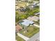 Neighborhood aerial shot showcasing lush green lawns and screened lanais at 2141 Rio De Janeiro Ave, Punta Gorda, FL 33983