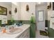 Traditional bathroom with neutral paint, a vanity with ample counter space, and a decorative mirror at 2141 Rio De Janeiro Ave, Punta Gorda, FL 33983