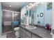 Updated bathroom features a large vanity and a glass-enclosed shower at 2141 Rio De Janeiro Ave, Punta Gorda, FL 33983
