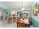 Cozy dining room adjacent to the kitchen with sliding glass doors leading to the outdoor lanai area at 2141 Rio De Janeiro Ave, Punta Gorda, FL 33983