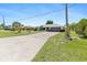 Well-maintained home with a long driveway and two-car garage, set in a manicured lawn at 2141 Rio De Janeiro Ave, Punta Gorda, FL 33983