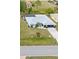 Charming single-story home featuring a screened-in lanai and well-maintained landscaping at 2141 Rio De Janeiro Ave, Punta Gorda, FL 33983