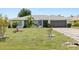 Charming home with lush landscaping, well-manicured lawn, and a two-car garage at 2141 Rio De Janeiro Ave, Punta Gorda, FL 33983