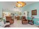 Open-concept living space flows to kitchen and dining area with access to lanai, creating a great layout for entertaining at 2141 Rio De Janeiro Ave, Punta Gorda, FL 33983