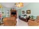 Comfortable living room with tile floors and ample natural light, creating a relaxing atmosphere for Gathering gatherings at 2141 Rio De Janeiro Ave, Punta Gorda, FL 33983